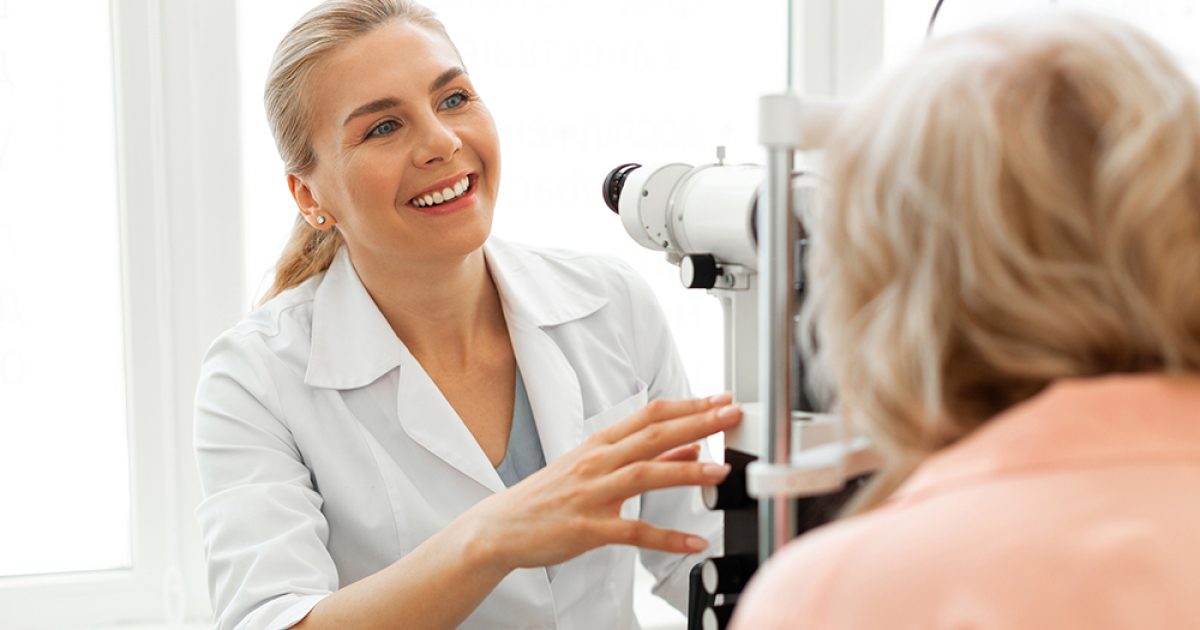 Eyesight,Check.,Laughing,Positive,Ophthalmologist,In,White,Uniform,Working,With