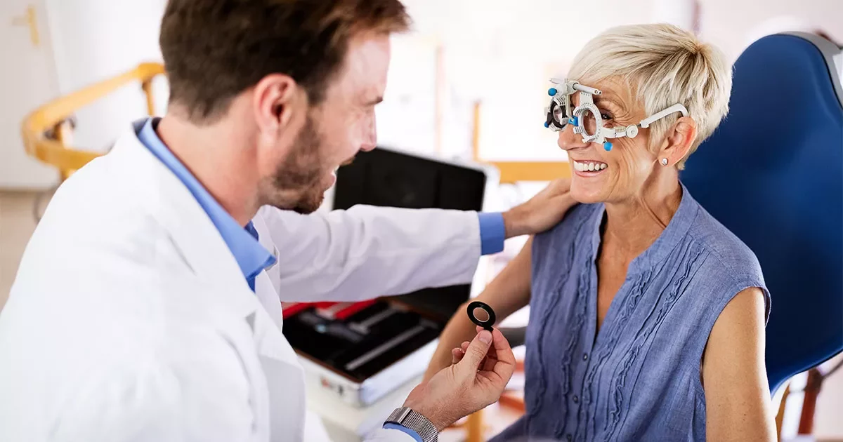 Doctor explaining cataract surgery options to happy patient