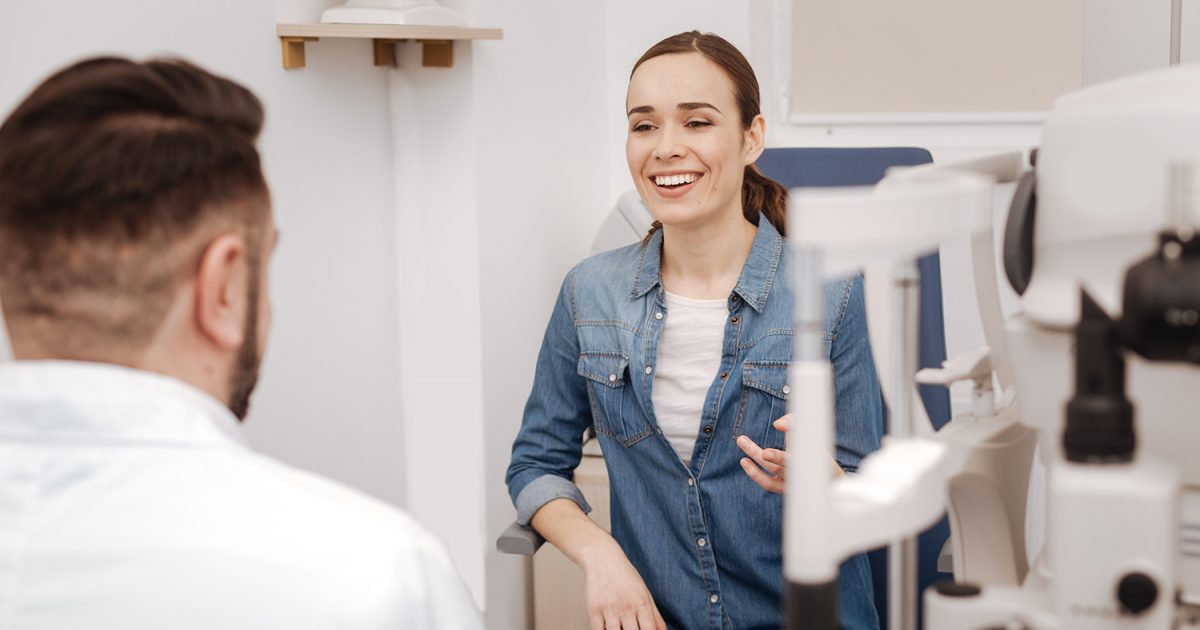 Happy positive woman interacting with her doctor
